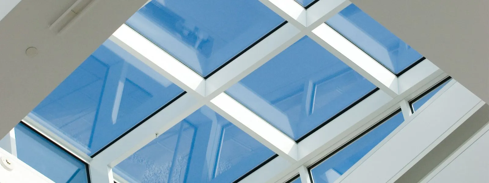Glazed roof lantern panes from below, blue sky